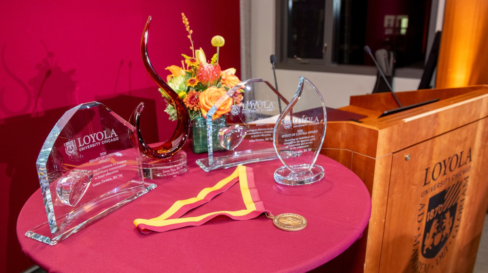 A table with the Alumni Awards presented at the ceremony.